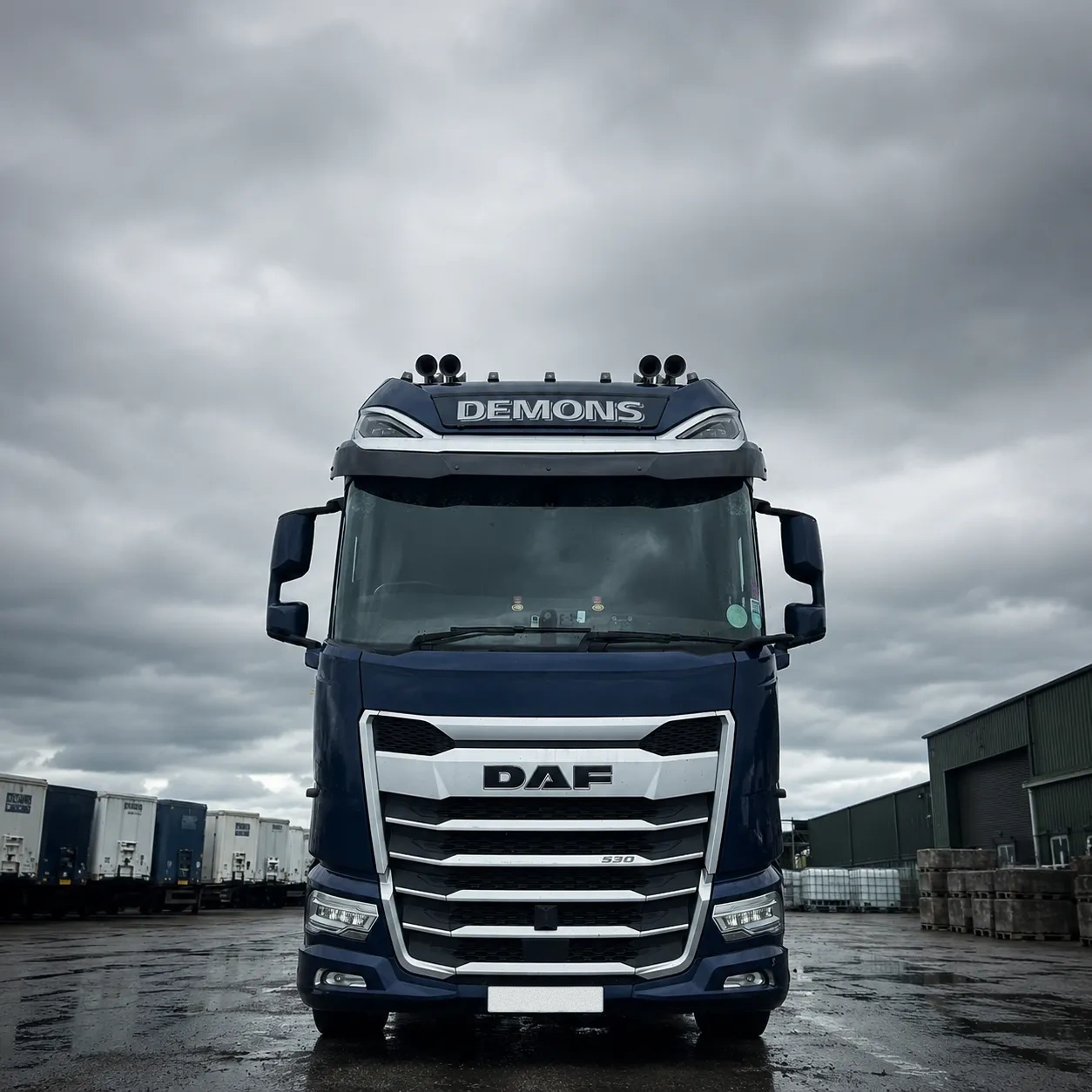 Tractor unit in the yard, trailers lined up behind